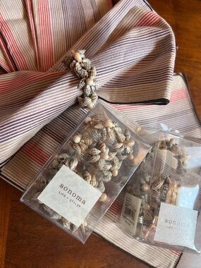 Sonoma Shell-Bead Napkin Rings with Striped Beige and Coral napkins coastal dine